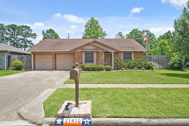 Charming single-story brick home with a two-car ga