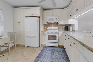 Hall with baseboards, recessed lighting, and light