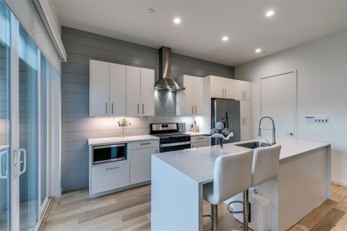 Kitchen featuring light countertops, stainless ste