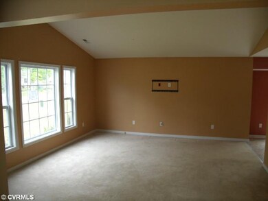 Living Room - There is a vaulted ceiling in the li