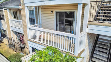 A bright second-floor balcony with white railings