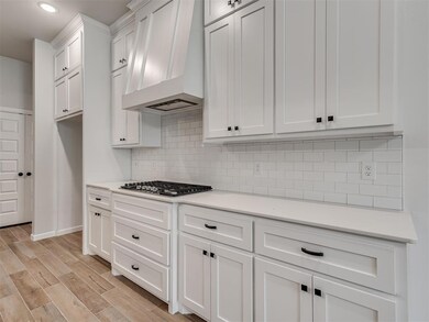 Kitchen with light hardwood / wood-style floors, p