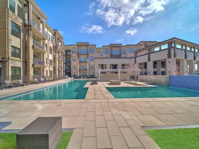 Pool with a patio area and fence
