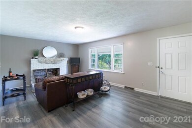 Entry way and living room opens to kitchen area.