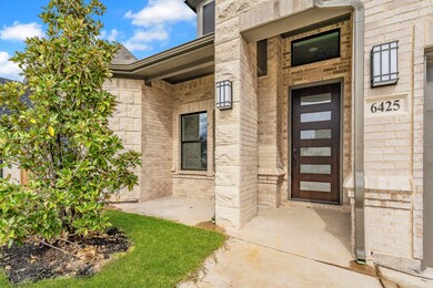 Entrance to property with brick siding