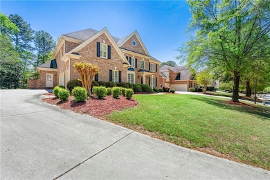View of front of house featuring brick siding, dri