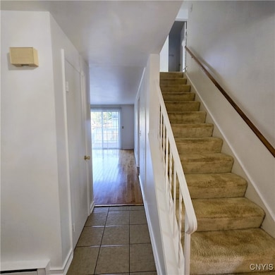 Foyer, another closet and a family room. Upstairs