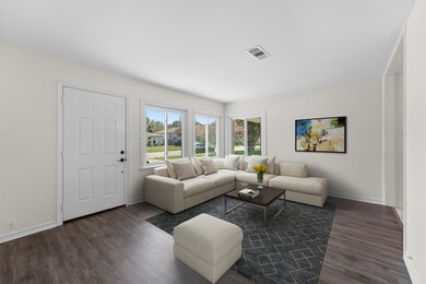 As you enter you are greeted by open concept living and a newly repainted home