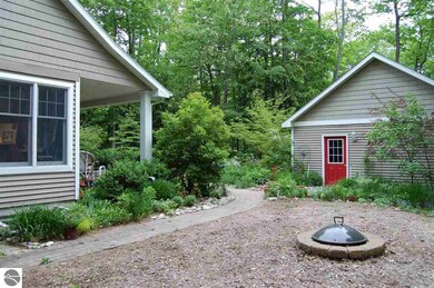 The side yard with fire pit.
