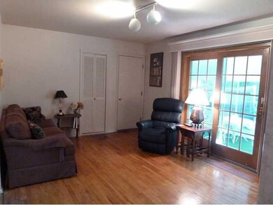 Family Room HARDWOOD FLOORING WITH EXIT TO GARAGE 