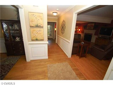 Foyer - Open foyer with hardwood floors and crown 