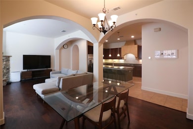 Dining space with arched walkways, a notable chand