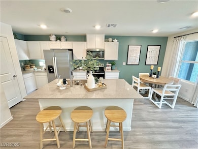 Kitchen featuring stainless steel appliances, whit