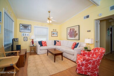 Living area w/ vaulted ceiling
