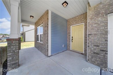 Rocking chair porch and an inviting front door awa