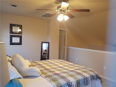 Loft Bedroom Upstairs has ceiling fan, carpet & pr