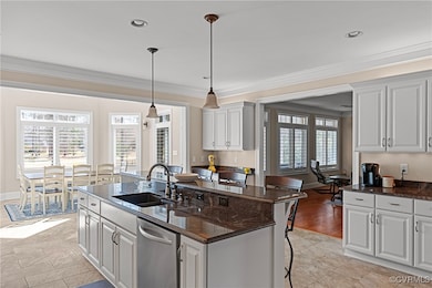 Kitchen with a breakfast bar area, a center island