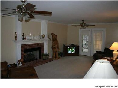 Family room has beautiful fireplace, very spacious
