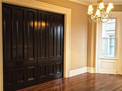 Tall, beautiful pocket doors separate the dining a