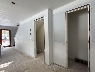 Newly insulated, sheetrocked walls and ceiling