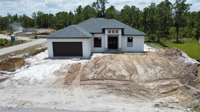 View of front of home with stucco siding, a garage