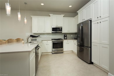 Kitchen with stainless steel appliances, gas range, soft close cabinets and quarts countertops