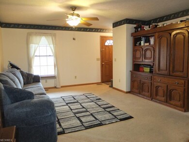 Formal living room is open to the dining room.