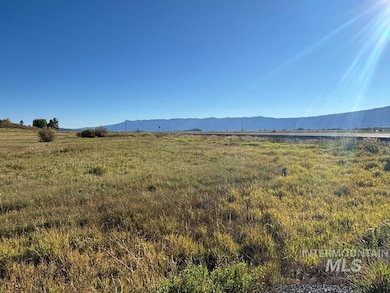 View of mountain backdrop featuring rural landscape