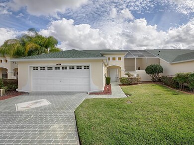 GORGEOUS LANDSCAPING AND PAVERED DRIVEWAY!