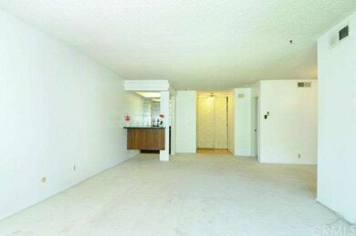 Looking from the balcony to the unit: Spacious liv