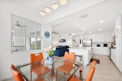 Dining space with crown molding and recessed lighting