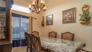 Dining area featuring a chandelier and tile patterned flooring