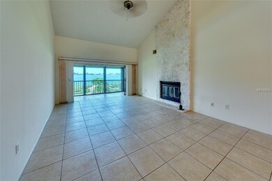 Living Room view with wood burning fireplace. Vaul