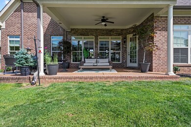 Relax on the covered patio, with a zero step access to the yard