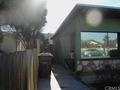 SIDE OF THE HOUSE THAT LEADS TO BIG BACKYARD
