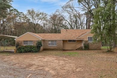 View of front of property featuring a carport