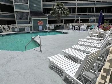 Community pool with a patio area