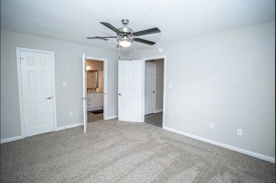 Unfurnished bedroom featuring a textured ceiling, 