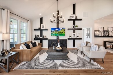 Living room with light hardwood / wood-style floor
