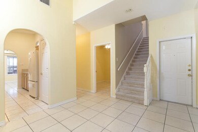 Entry, dining, galley kitchen, staircase