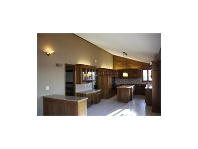 Kitchen has new granite and tile backsplash.