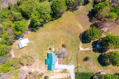 That big structure with the white metal roof is the huge barn