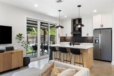Kitchen featuring stainless steel refrigerator wi
