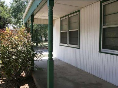 Large front covered patio.