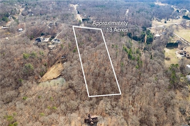 Aerial view of property and surrounding area with 