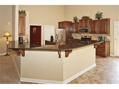 Kitchen. Elevated counter tops allows for placement of bar stools.