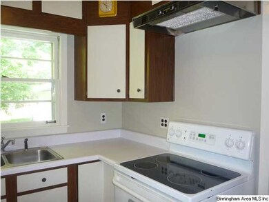 Another view of the kitchen including the oven.