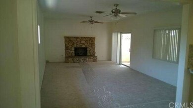 Family Room with fireplace and sliding doors to en