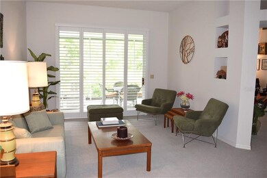 Open formal living room with sliding doors and pla