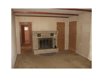 Living Room. Wood burning fireplace with gas start
